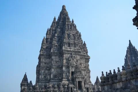 Detailed low angle view of stone spire top architecture at Prambanan temple. Stockfoto's
