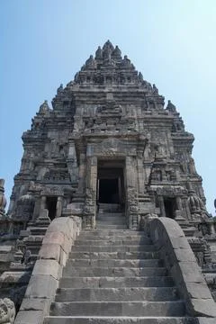 Detailed low angle view of stone spire top architecture at Prambanan temple. 스톡 사진