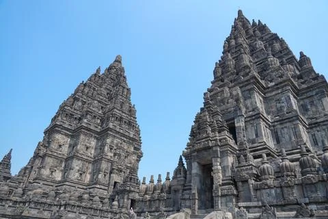 Detailed low angle view of stone spire top architecture at Prambanan temple. 스톡 사진