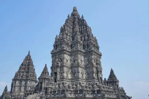 Detailed low angle view of stone spire top architecture at Prambanan temple. 스톡 사진