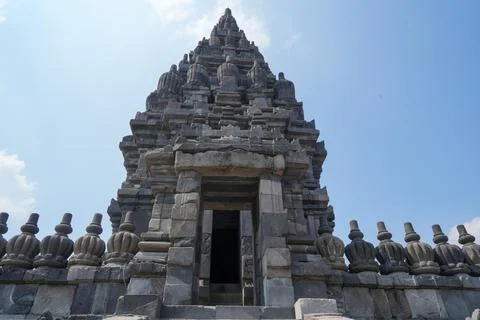 Detailed low angle view of stone spire top architecture at Prambanan temple. Stock-Fotos