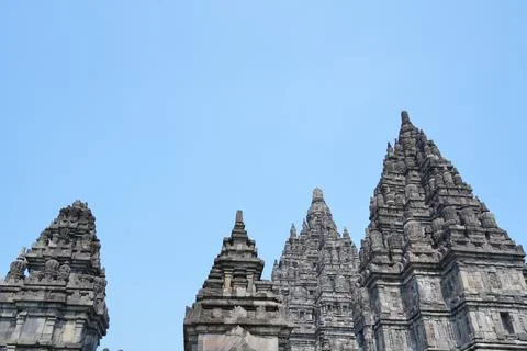 Detailed low angle view of stone spire top architecture at Prambanan temple. Stock-Fotos