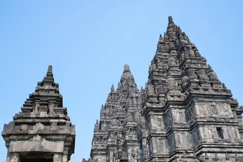 Detailed low angle view of stone spire top architecture at Prambanan temple. 스톡 사진