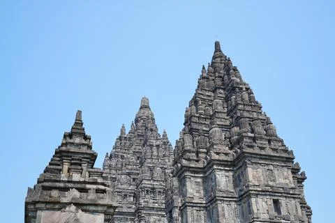 Detailed low angle view of stone spire top architecture at Prambanan temple. 스톡 사진