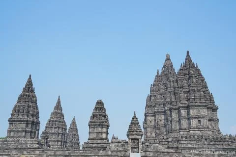 Detailed low angle view of stone spire top architecture at Prambanan temple. 스톡 사진