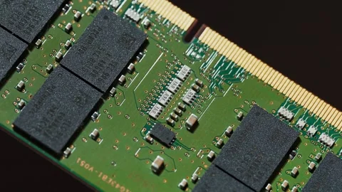 Detailed macro panning shot of a computer RAM (Random Access Memory) module. Stock Footage 345659894