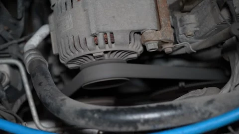 Detailed Macro Shot of Engine Belt and Pulley System During Car Maintenance Work Stock Footage 346338678