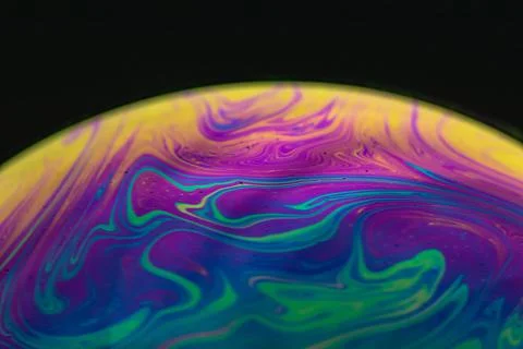 Detailed macro shot of a soap bubble - abstract and colorful pattern Stock Photos