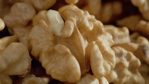 Detailed macro shot of a walnut kernel highlighting its unique texture Stock Footage 327582122