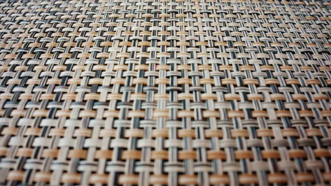 A detailed macro shot of a woven material reveals an intricate pattern of Stock Footage 336822979