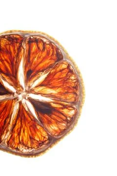 Detailed macro of translucent orange slice with seeds, backlit citrus fruit Foto stock