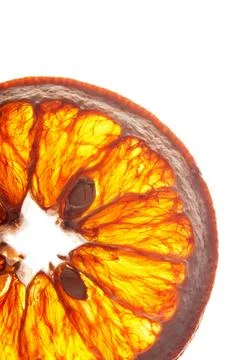 Detailed macro of translucent orange slice with seeds, backlit citrus fruit Foto stock