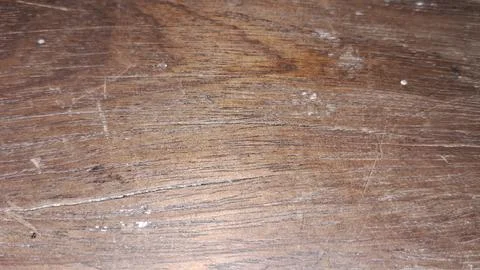 Detailed macro view of aged dark brown scratched wooden surface texture Stock Photos