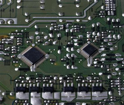 Detailed macro view of electronic circuit board with microcontrollers Stock Photos