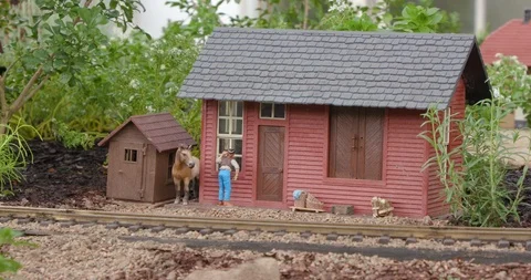 Detailed Model Train Set in Miniature Town Passing Home Vídeo Stock 99462562