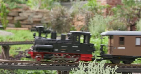 Detailed Model Train Set in Miniature Town Going Around Curved Track Stock Footage 99462703