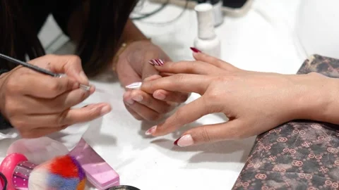 Detailed Nail Art Application with Professional Tools Stock Footage 325528843