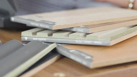 Detailed plan of tile and cladding samples on a table Stock Footage 342473304