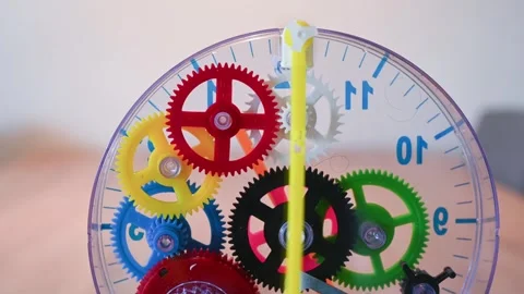 Detailed plastic clockwork toy showing gears and moving pendulum Stock Footage 320491850