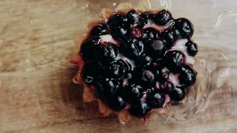 Detailed plating process view: arranging assorted tartlets in neat rows Stock Photos