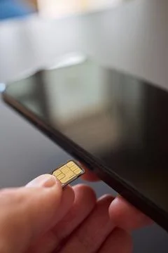 Detailed Process of Installing a SIM Card Utilizing Various Smartphone Stock Photos