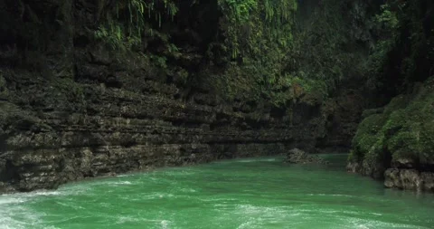 Detailed River Flow Through Jungle Canyon with Natural Rock Texture Stock-Footage 332654782