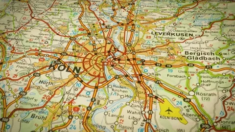 Detailed road map to cologne, germany – gliding view over atlas map Stock Footage 346188261