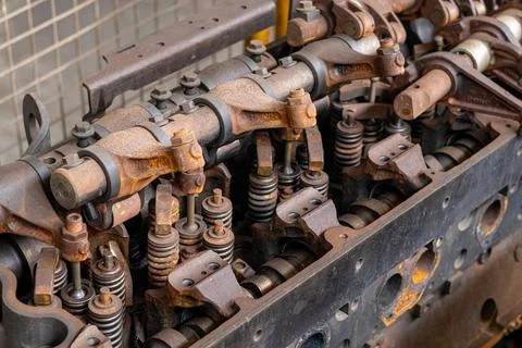 Detailed rusty engine cylinder head with valves and rocker arms. 스톡 사진