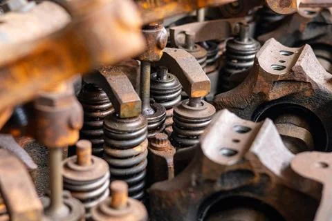 Detailed rusty engine cylinder head with valves and rocker arms. Stock Photos