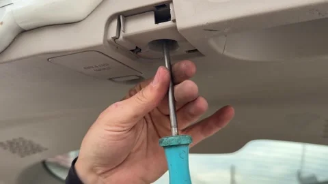 A detailed shot of a hand using a flathead screwdriver Stock Footage 320262057