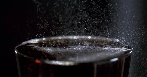 Detailed slow motion of bubbles forming in a drink Stock Footage 337845596