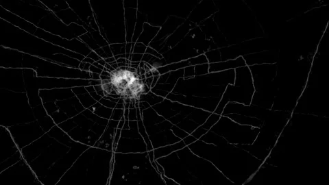Detailed spiderweb glass crack effect on black background Stock Footage 337208955
