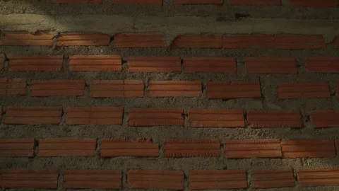 Detailed static shot of a red brick wall surface, ideal for backgrounds, arch Stock Footage 322112954
