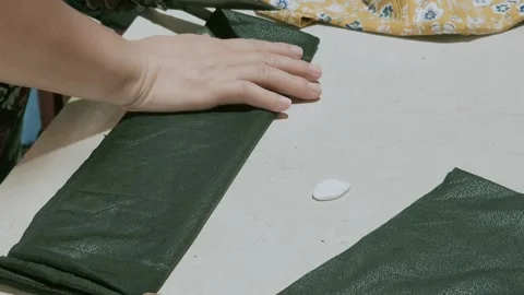 Detailed Steps in Cutting and Preparing Fabric for a Handmade Project Stock Footage 295290128