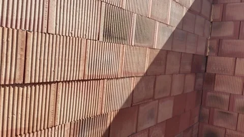 Detailed texture and pattern of porous ceramic bricks forming a structural wall. Stock Footage 334653190