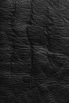 Detailed texture background of black colored wrinkled metallic leather with.. Stock Photos