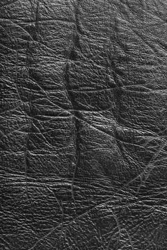 Detailed texture background of gray colored wrinkled metallic leather with .. Stockfoto's