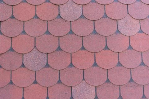 Detailed texture, background. Red bituminous shingles, roofing material Stock Photos