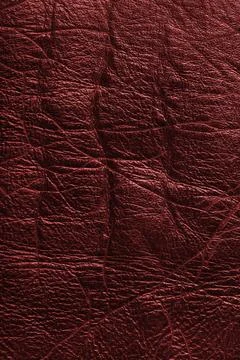 Detailed texture background of red colored wrinkled metallic leather with n.. Stock Photos