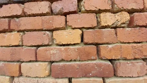 Detailed texture of an old weathered red brick wall Stock Footage 333778282