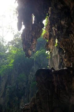Detailed texture of rugged limestone cave walls and ceiling at Batu Caves Stock Photos