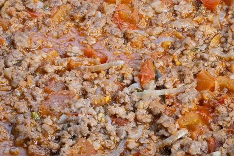 Detailed texture savory meat ragu topping, plating suggestion by chef, sprinkled Stock Photos
