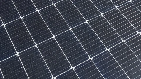 Detailed texture of solar panel surface with cells and sun reflection Stock Footage 334388426