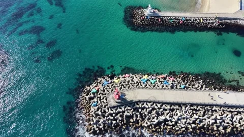 Detailed Top Down Drone View of Harbor Pier and Turquoise Coastal Water Stock Footage 344778300