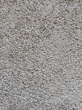 Detailed top down view of a rough grey concrete floor surface with concrete text Stock Photos