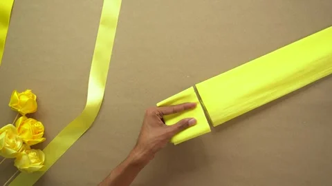 Detailed tutorial on creating yellow ribbon flowers by hand 스톡 동영상 299828766