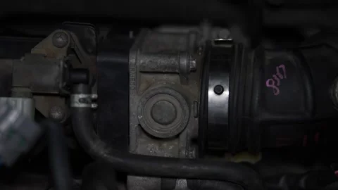 Detailed view of car engine throttle body assembly component part. Stock Footage 344231351