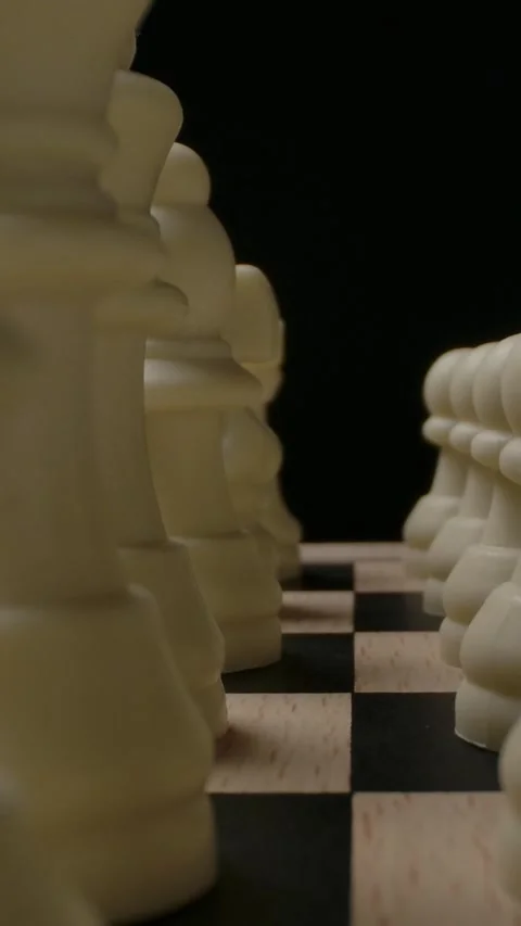 A detailed view of chess pieces positioned on a chessboard, showcasing a Vidéo 276923662
