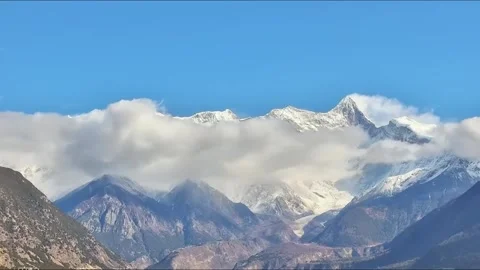 Detailed View of Clouds and Snow Peaks in Linzhi Tibet Stock-Footage 334720725