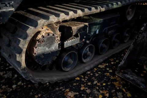 Detailed view of compact loader rubber track undercarriage Stock Photos